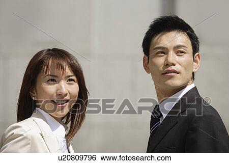 Stock Photograph - View of two professionals on a sunny day. Fotosearch