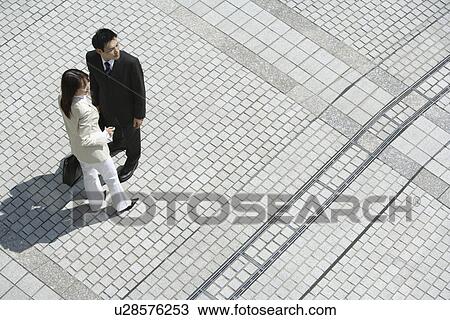 Stock Image - View of two professionals. Fotosearch