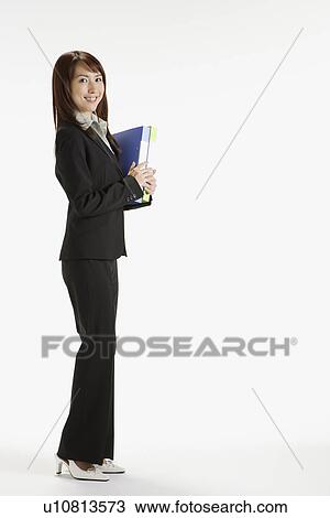 Businesswoman holding a file, portrait View Large Photo Image Stock Image - Businesswoman holding a file, portrait. Fotosearch