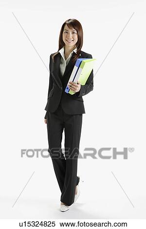 Businesswoman holding a file, portrait View Large Photo Image Stock Photography - Businesswoman holding a file, portrait. Fotosearch