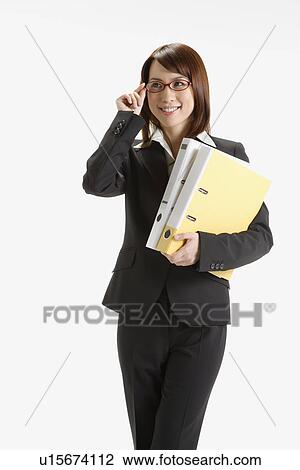 Cheerful executive holding a file, portrait View Large Photo Image Stock Image - Cheerful executive holding a file, portrait. Fotosearch