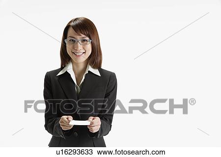 Cheerful executive holding a paper, portrait View Large Photo Image Stock Image - Cheerful executive holding a paper, portrait. Fotosearch