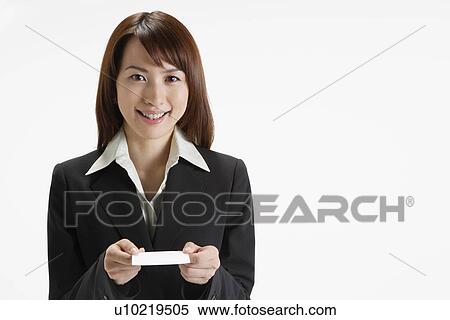 Stock Photography - Cheerful executive holding a paper, portrait. Fotosearch