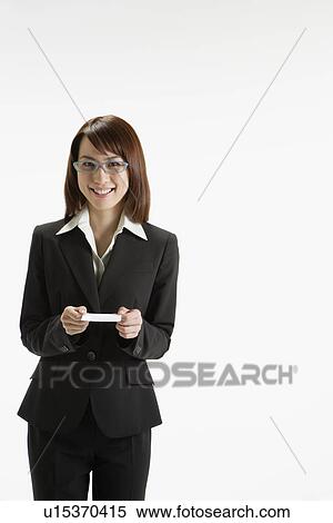 Stock Photography - Cheerful executive holding a paper, portrait. Fotosearch