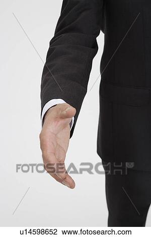 Stock Image - Man extending his palm, portrait. Fotosearch