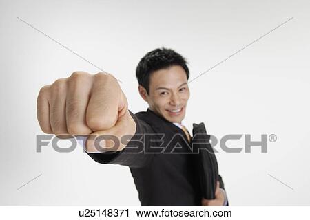 Stock Image - Man posing for the camera, portrait. Fotosearch