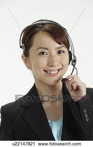 Young woman with a headphone, portrait View Large Photo Image Stock Image - Young woman with a headphone, portrait. Fotosearch