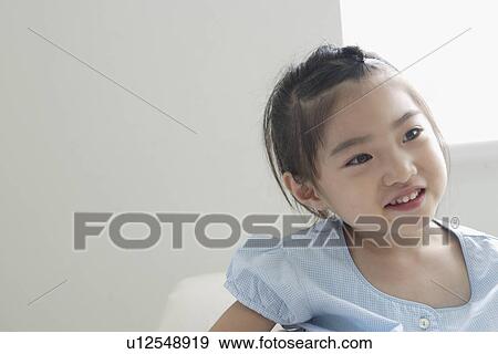 Stock Photo - A girl in gingham dress. Fotosearch