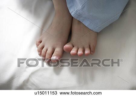 Stock Image - Bear feet of child. Fotosearch