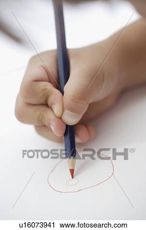 Stock Image - Hand of a child, drawing doodle. Fotosearch