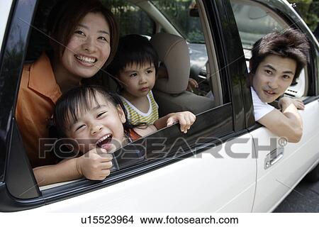 Picture - A family in a car. Fotosearch