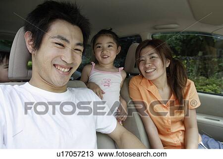 Stock Image - A family in a car. Fotosearch