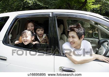 Stock Photography - A family in a car. Fotosearch