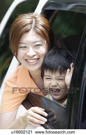 Stock Image - A mother and son in a car. Fotosearch
