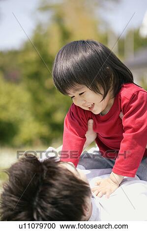 A son enjoying the company of his father View Large Photo Image Stock Image - A son enjoying the company of his father. Fotosearch