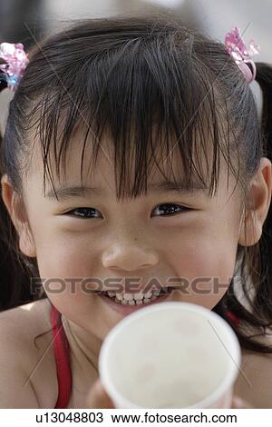 Stock Image - Face of smiling girl. Fotosearch