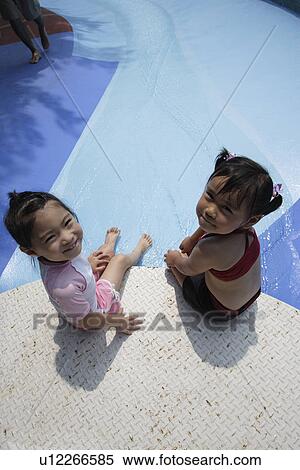 Stock Photography - Two girls at pool. Fotosearch