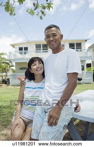 A couple smiling at garden View Large Photo Image Stock Image - A couple smiling at garden. Fotosearch
