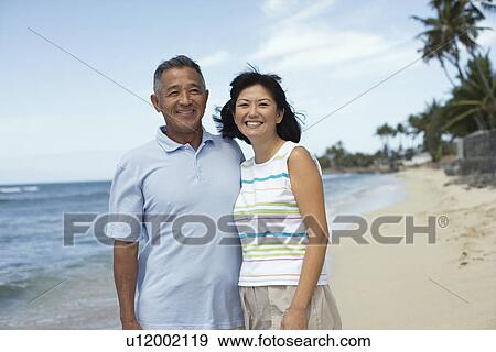 Stock Photo - Portrait of a couple at beach. Fotosearch