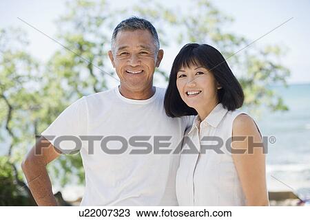 Stock Image - Portrait of a couple smiling. Fotosearch