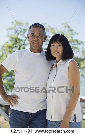 Portrait of a couple smiling View Large Photo Image Stock Image - Portrait of a couple smiling. Fotosearch