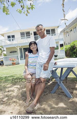 Stock Photo - View of a couple at garden. Fotosearch