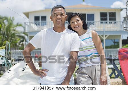 Stock Photo - View of a couple smiling. Fotosearch
