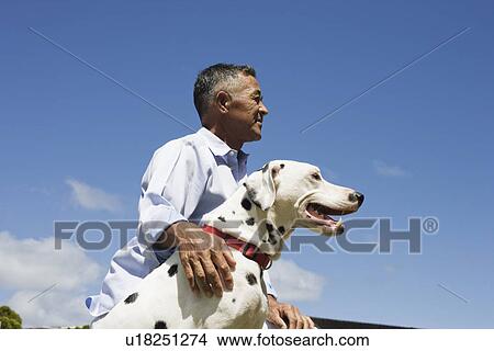 Picture - Profile of man with dog. Fotosearch