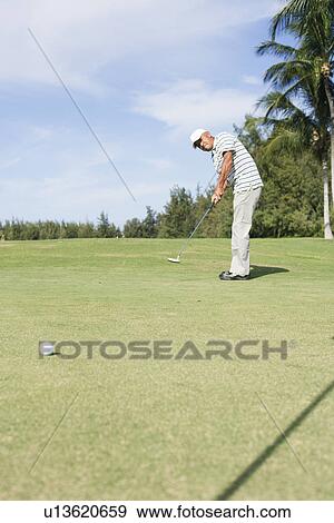 Mature man playing golf View Large Photo Image Stock Photo - Mature man playing golf. Fotosearch