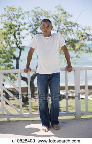 Stock Image - Mature man standing. Fotosearch