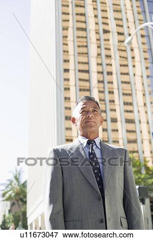 Stock Photo - View of a businessman standing. Fotosearch
