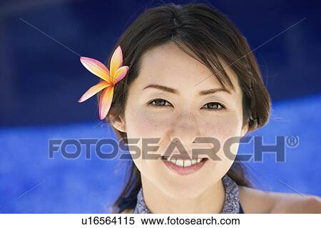 Stock Photography - Portrait of a young woman smiling. Fotosearch