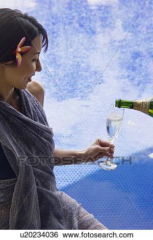 View of a smiling young woman with drinks View Large Photo Image Stock Photograph - View of a smiling young woman with drinks. Fotosearch
