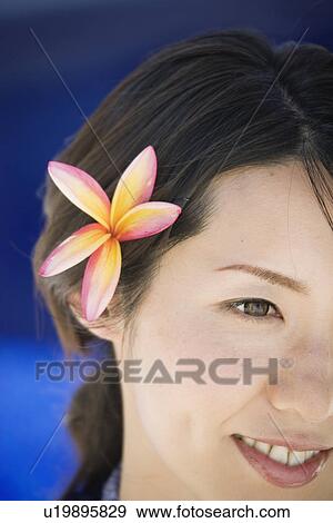 View of a young woman smiling View Large Photo Image Stock Photo - View of a young woman smiling. Fotosearch