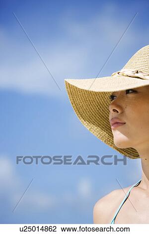 Close-up of a woman wearing hat View Large Photo Image Stock Image - Close-up of a woman wearing hat. Fotosearch