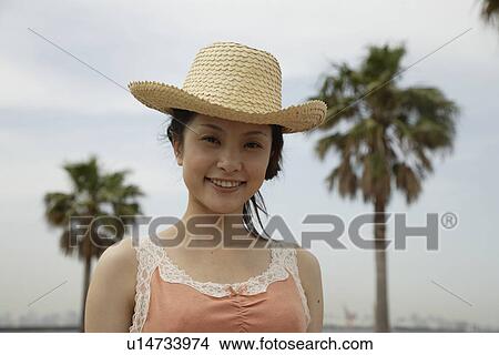 Picture - Portrait of a young woman smiling. Fotosearch