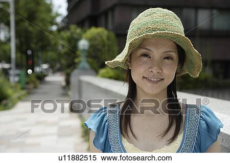 Stock Photography - Portrait of a young woman smiling. Fotosearch