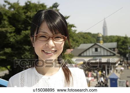 Stock Photography - Portrait of a young woman smiling. Fotosearch
