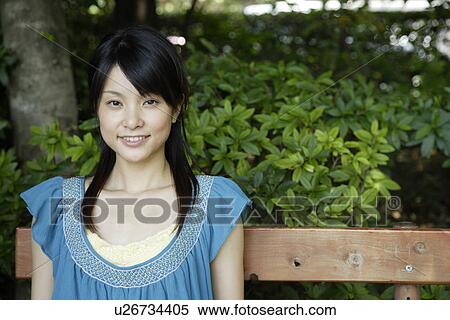 Stock Photography - Portrait of a young woman smiling. Fotosearch