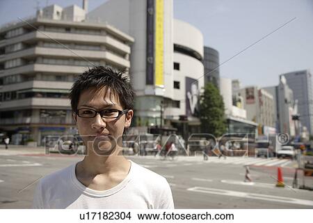 Portrait of a young man smiling View Large Photo Image Picture - Portrait of a young man smiling. Fotosearch