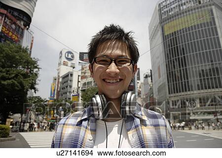 Portrait of a young man smiling View Large Photo Image Picture - Portrait of a young man smiling. Fotosearch