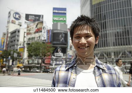 Stock Image - Portrait of a young man smiling. Fotosearch