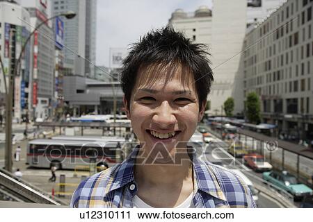 Portrait of a young man smiling View Large Photo Image Stock Image - Portrait of a young man smiling. Fotosearch