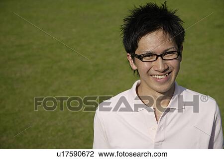 Stock Image - Portrait of a young man smiling. Fotosearch