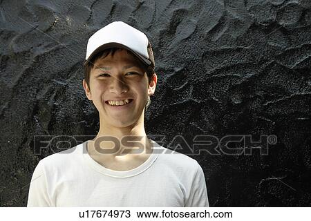 Stock Image - Portrait of a young man smiling. Fotosearch