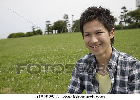 Stock Image - Portrait of a young man smiling. Fotosearch