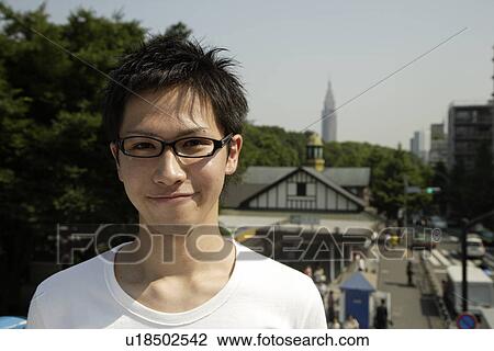 Portrait of a young man smiling View Large Photo Image Stock Image - Portrait of a young man smiling. Fotosearch