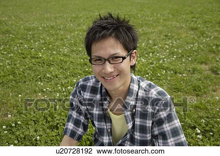 Stock Image - Portrait of a young man smiling. Fotosearch