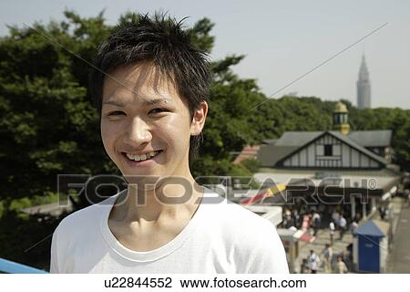 Stock Image - Portrait of a young man smiling. Fotosearch