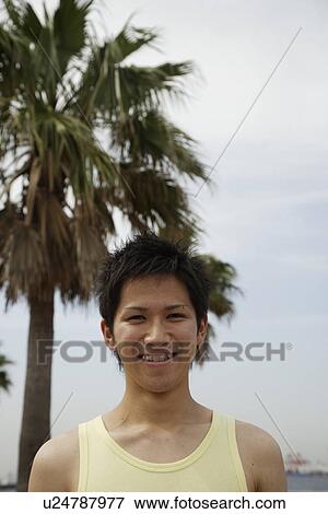 Stock Photo - Portrait of a young man smiling. Fotosearch